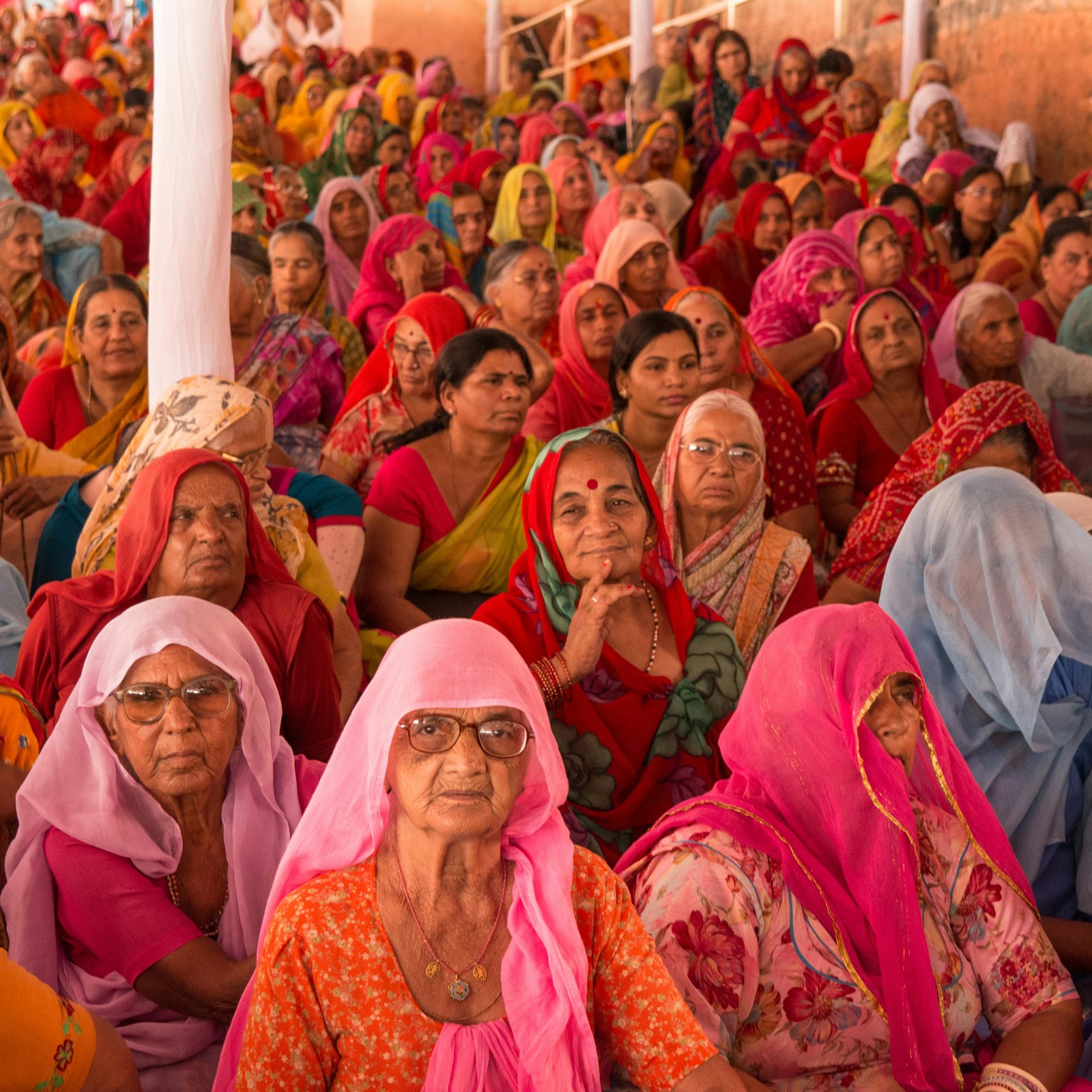 Community meeting with villagers in a rural setting